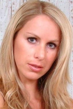 Adele Stephens in a blonde-haired head-and-shoulders portrait